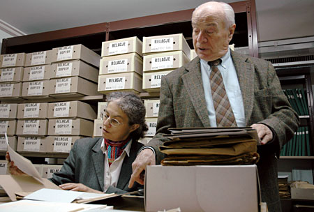 Dr. Eleonora Bergman and Professor Dr. Feliks Tych examining documents in the Jewish Historical Institute's collections.